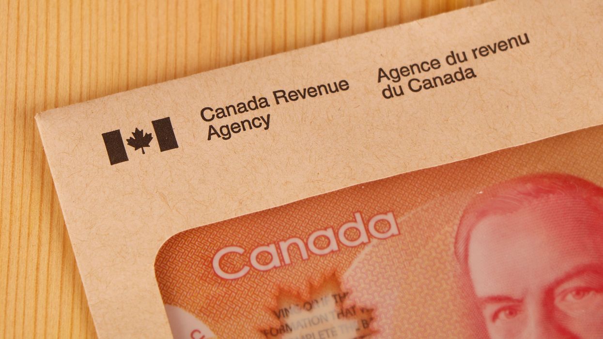 CRA envelope with Canadian money (illustrative).
