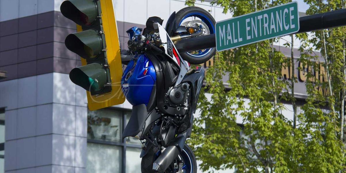 Crash leaves motorcycle hanging from traffic light Crash leaves motorcycle hanging from traffic light