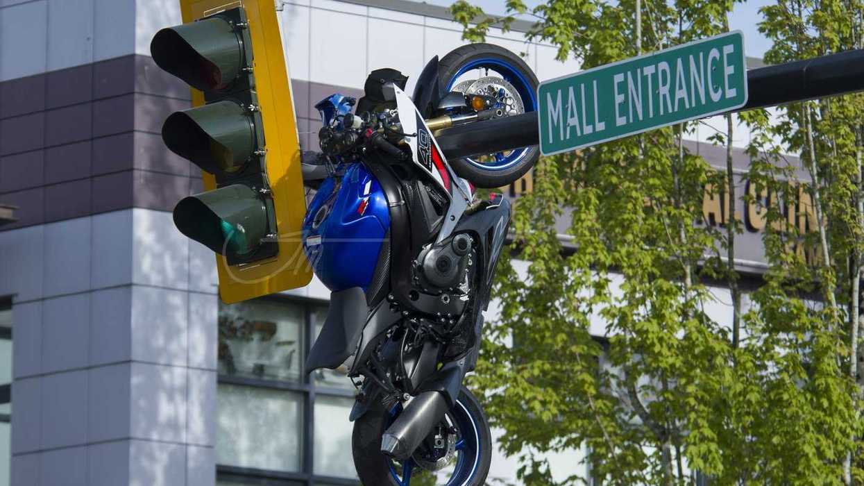 Crash leaves motorcycle hanging from traffic light