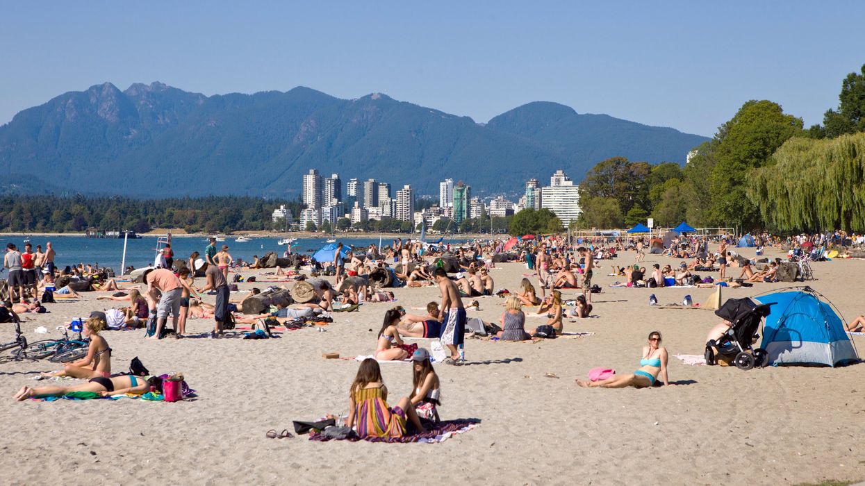 Crowded Vancouver beach on a summer day.