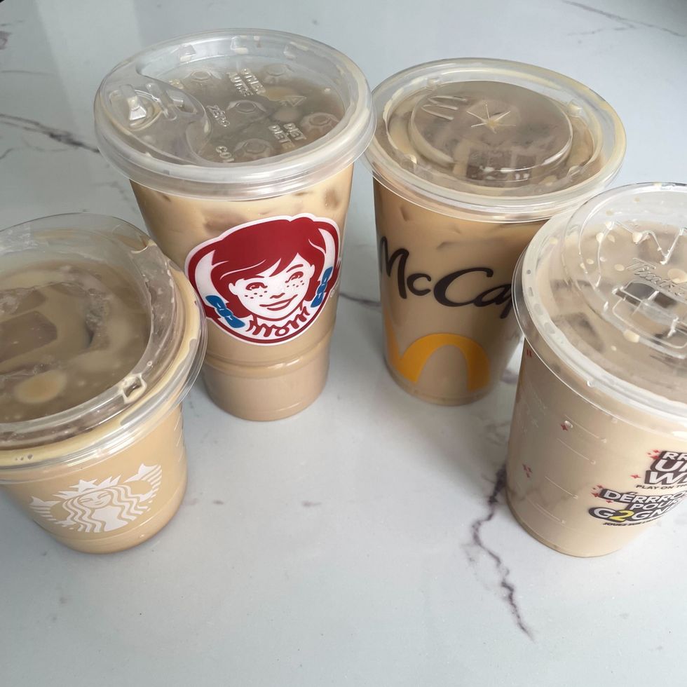 cups of starbucks, wendy's, mcdonald's and tim hortons iced coffees