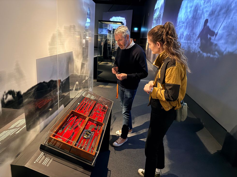 Curator Tim Foran shows Elisha Barry a Civil War surgical set.