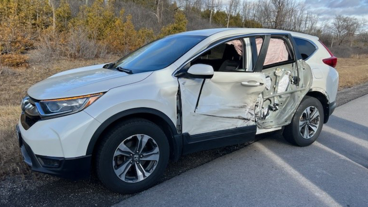 Damaged car in wheel-off incident.
