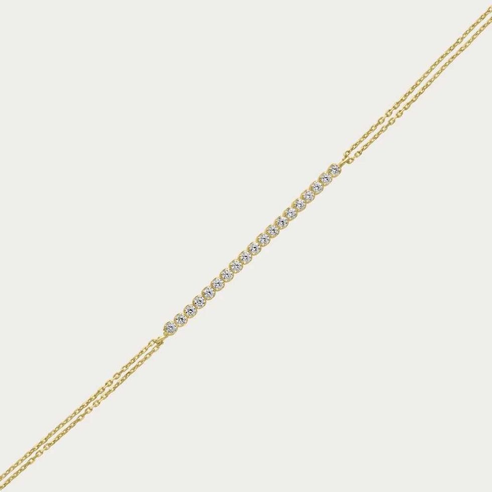 Delicate gold bracelet with diamonds.