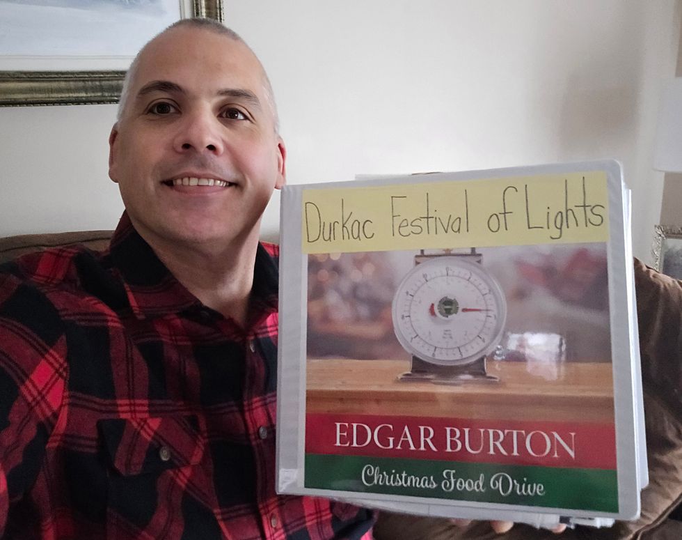 Derek Durkac with his Festival of Lights binder.