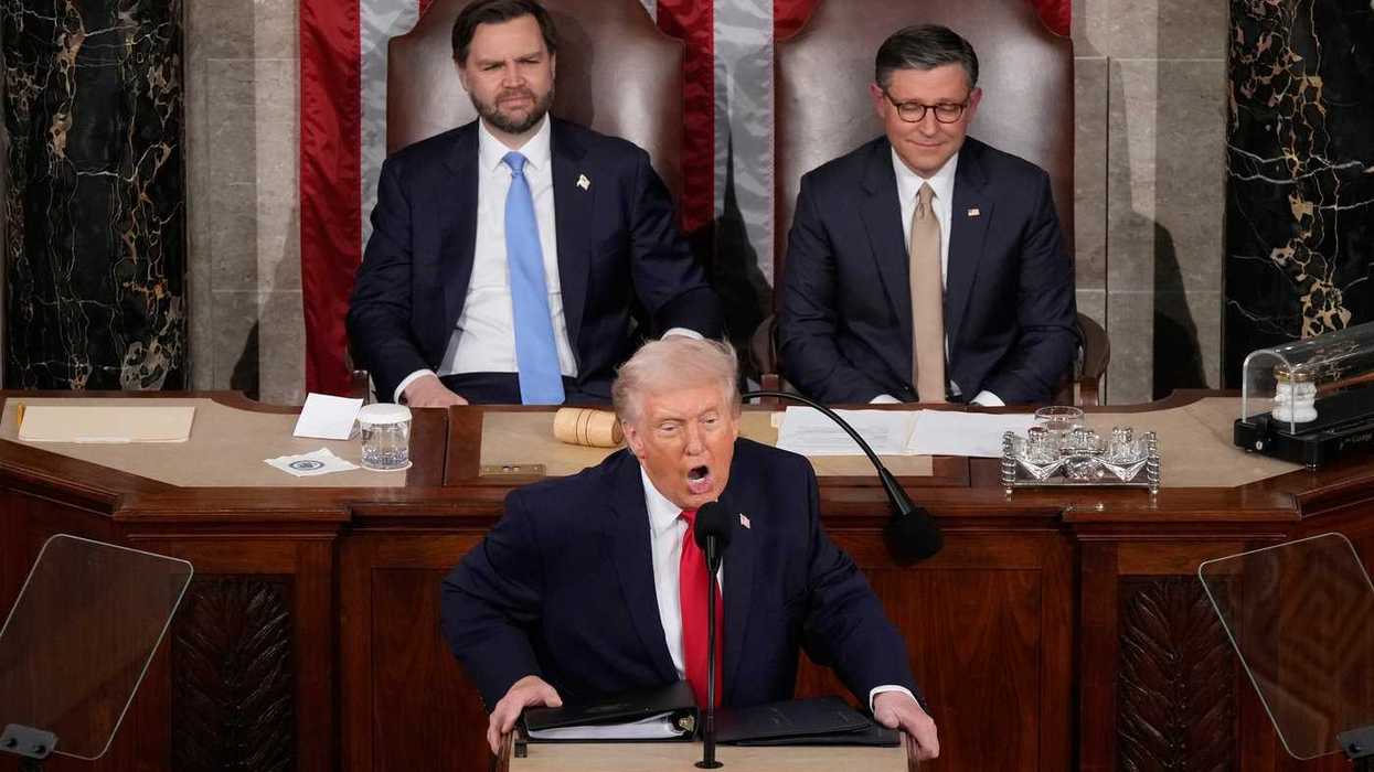 Donald Trump delivers the State of the Union address at the U.S. Capitol as Vice President JD Vance and House Speaker Mike Johnson listen.