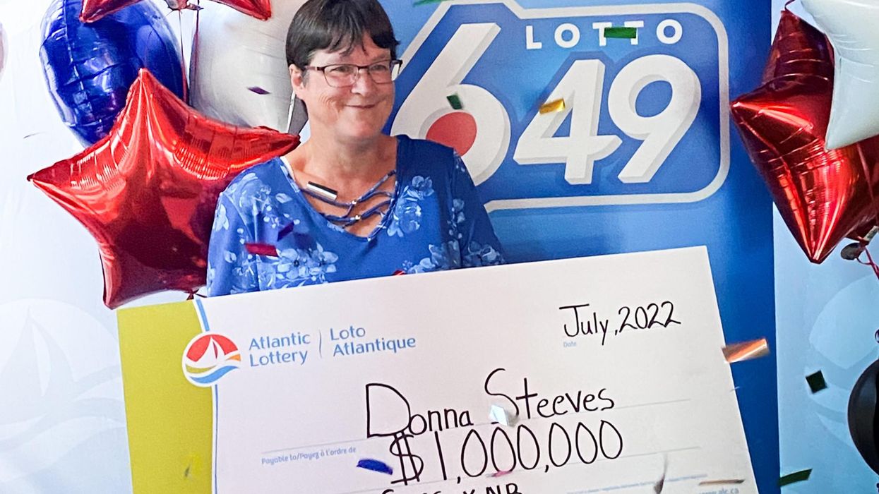 Donna Steeves with a cheque for $1 million.