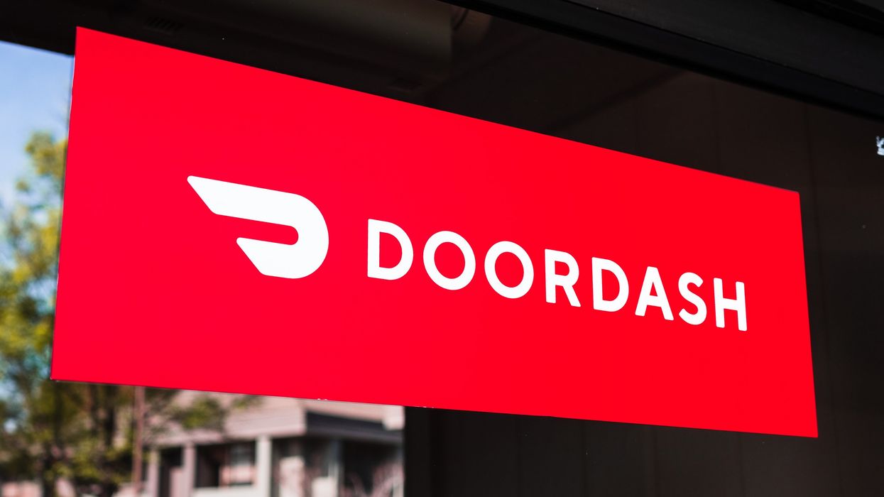 Doordash sign on a restaurant window.