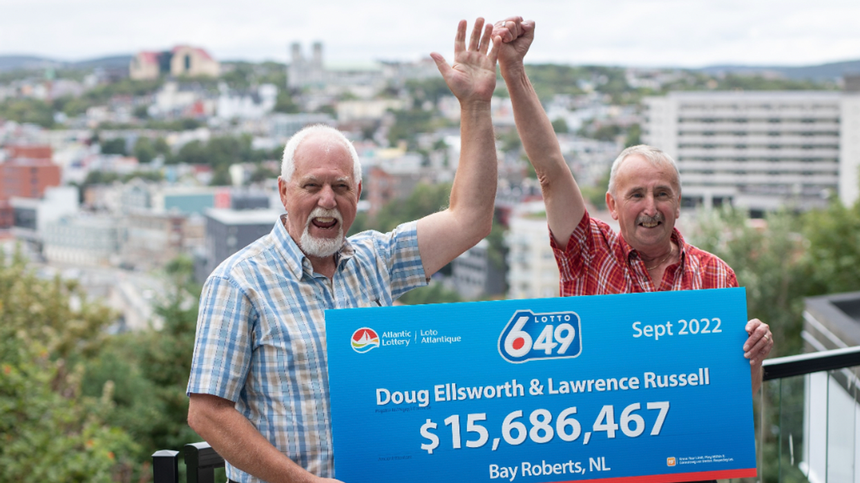 Doug Ellsworth and Lawrence Russell with a Lotto 6/49 winning cheque.