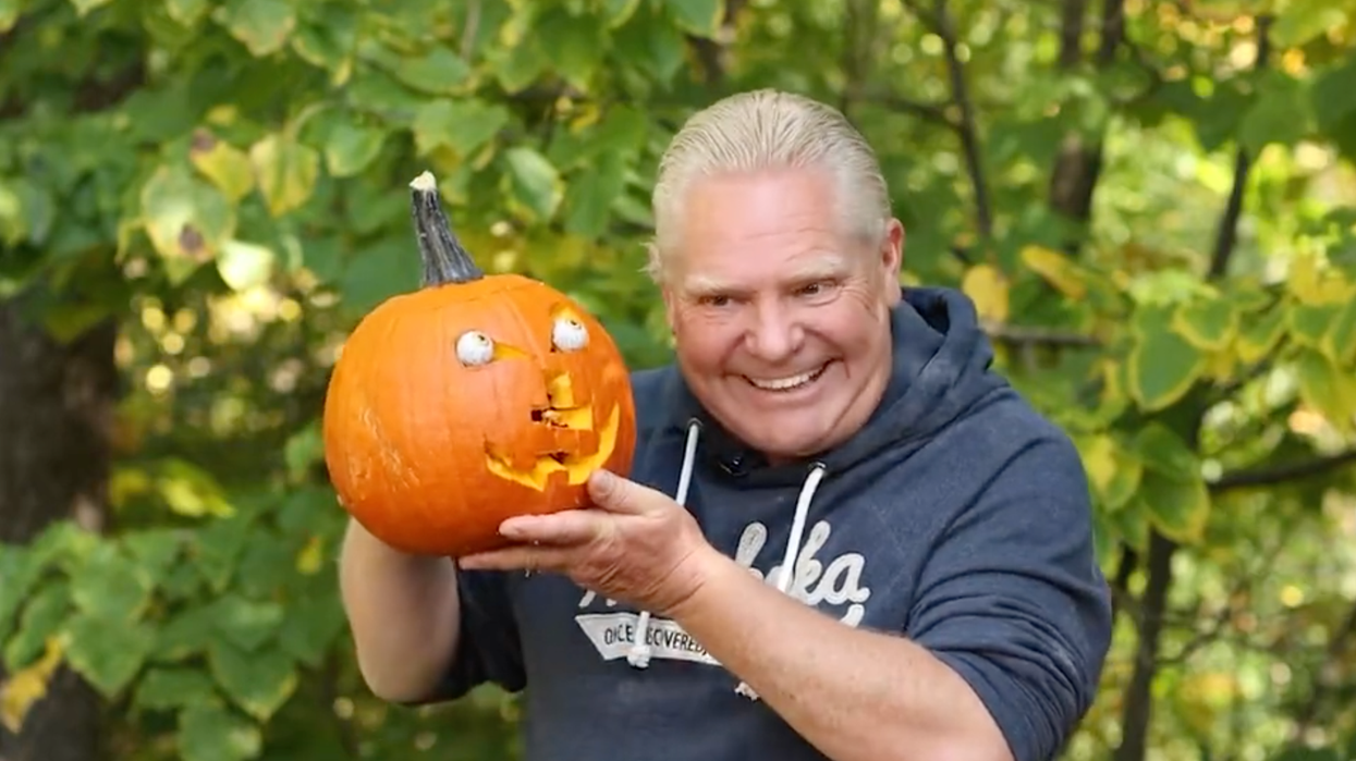 Doug Ford and his carved pumpkin.
