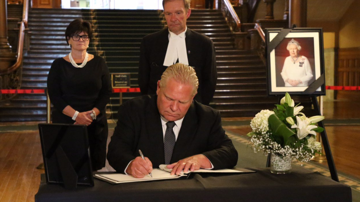 Doug Ford signing the books of condolence for the late Queen Elizabeth II.