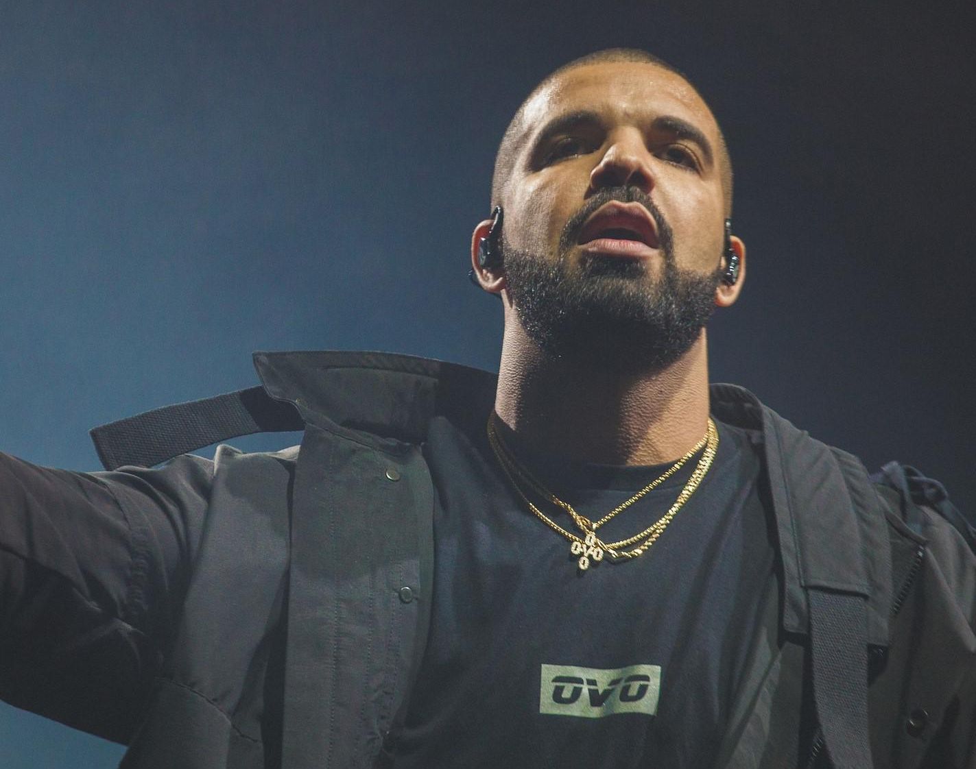 Drake wearing an OVO shirt.