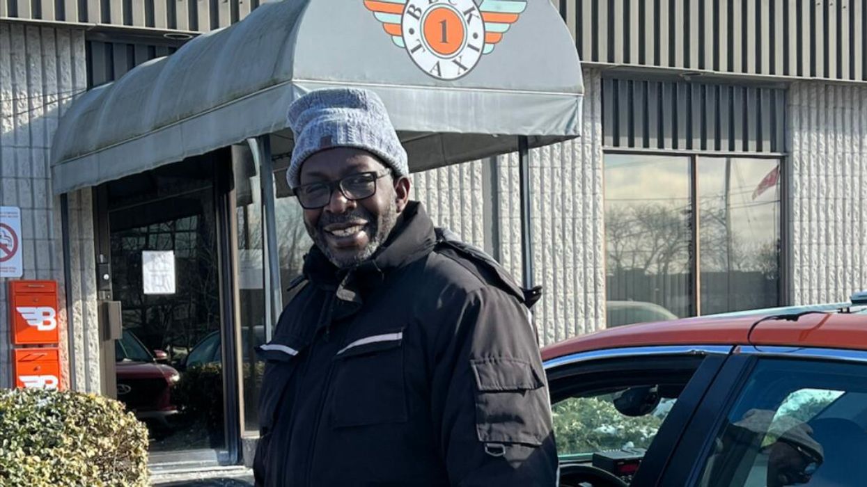 Driver Vernon Warnor in front of Beck Taxi.