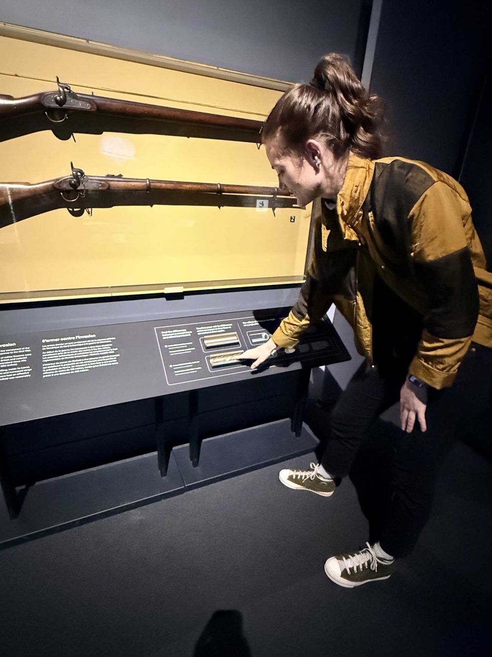 Elisha Barry feels the difference between older (smoothbore) and newer (rifled) musket barrels.