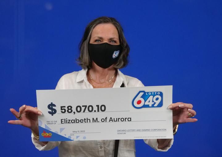 Elizabeth MacGillivray with her big cheque.
