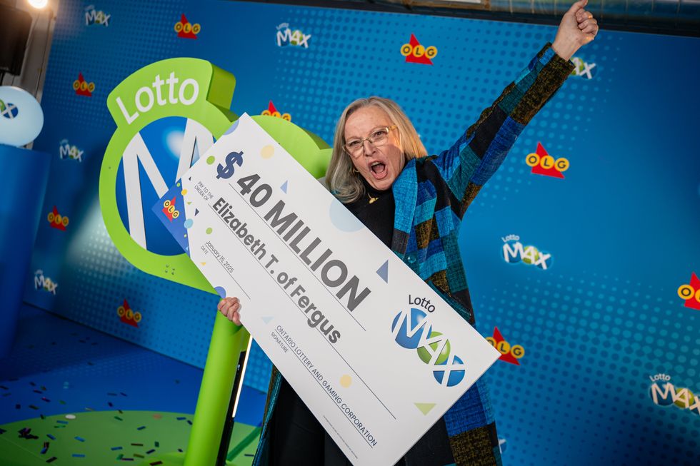 elizabeth trafford celebrating with a $40 million lotto max cheque