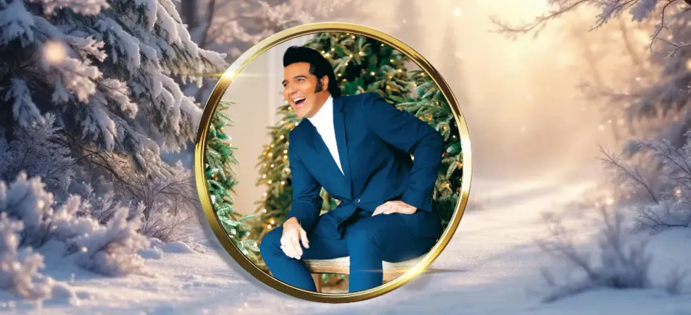 Elvis in a blue suit sits in a gold circular frame, posed in front of decorated Christmas trees, with a snowy winter forest background outside the frame.