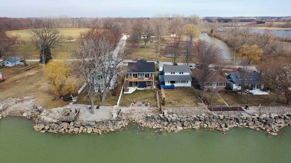 Exterior aerial shot of the home and neighbouring houses.