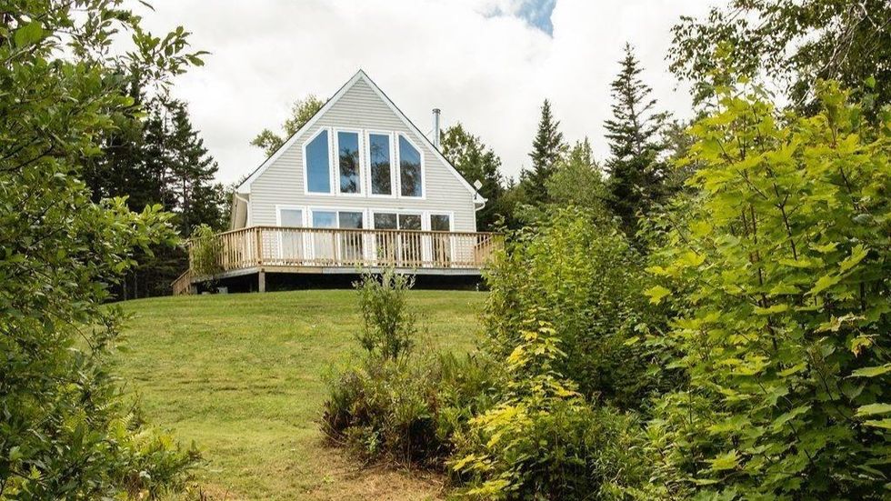 Exterior and backyard of the house for sale.