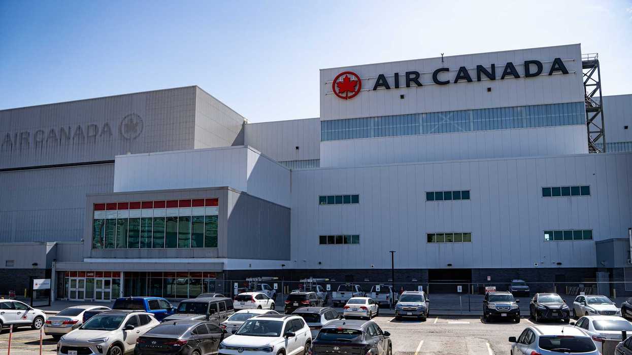 exterior of air canada airport facility in ontario with cars in parking lot