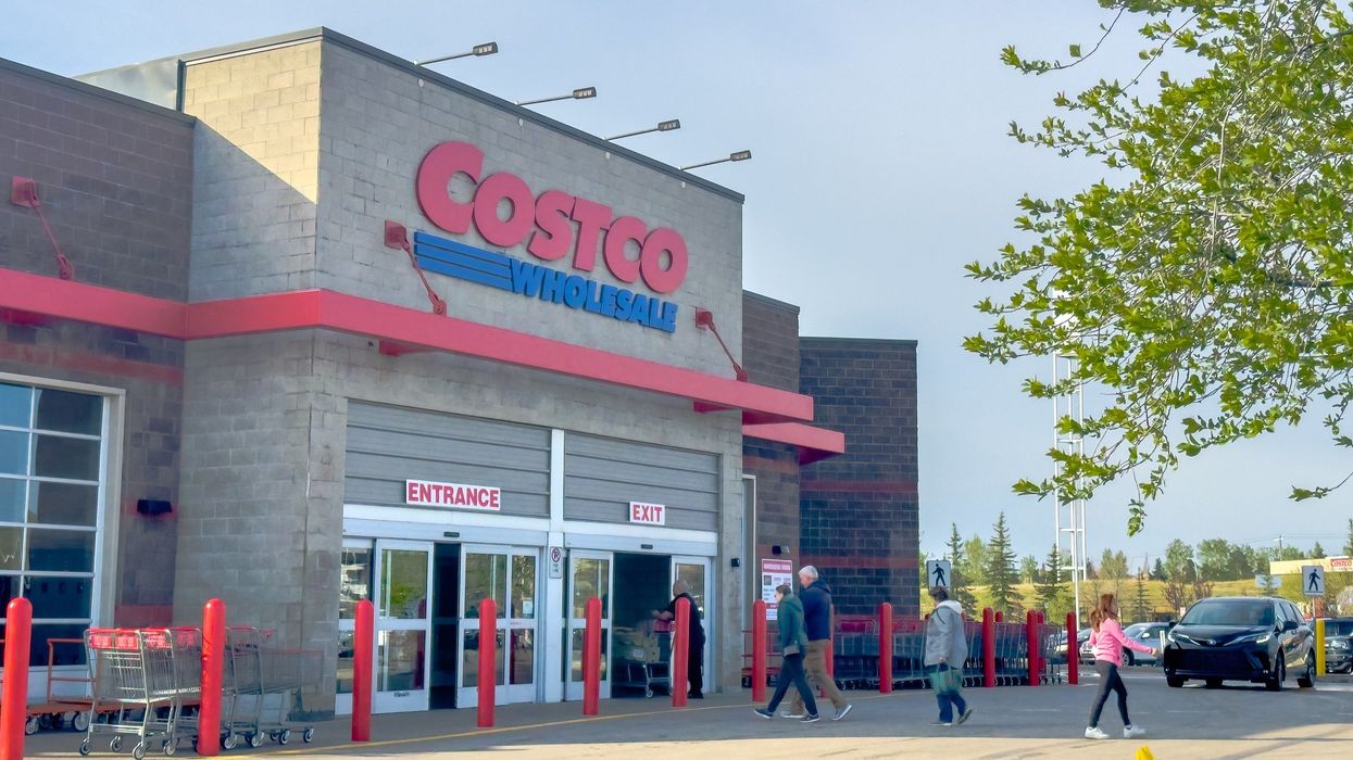 exterior of costco canada store with people wlaking by