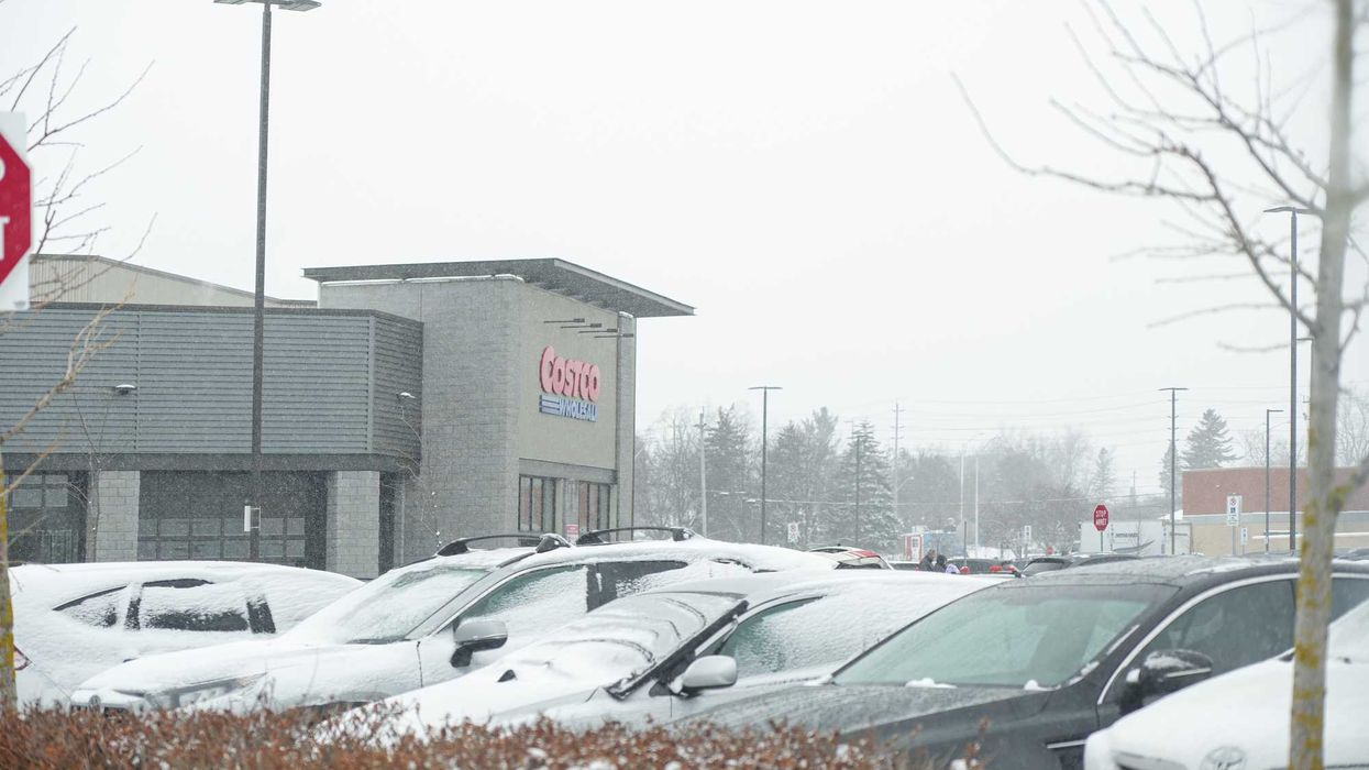 exterior of costco store in ontario while it snows
