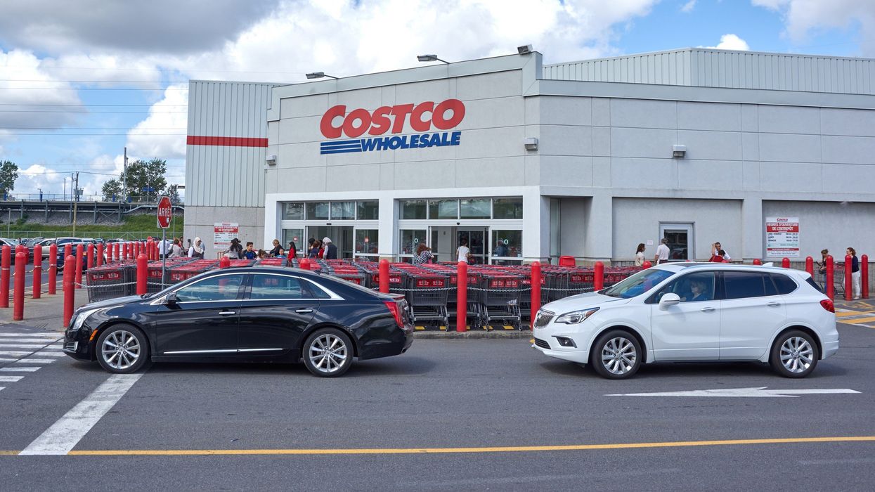 exterior of costco warehouse location in canada with cars and people