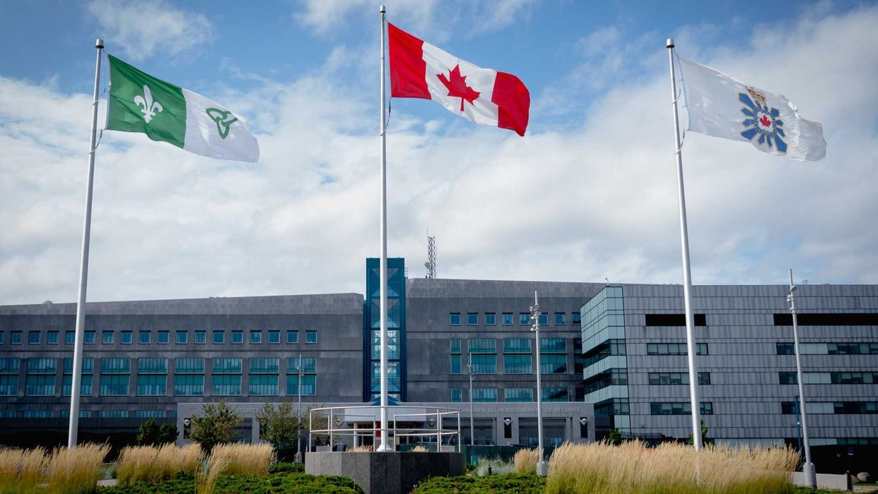 exterior of csis office in ontario with flags