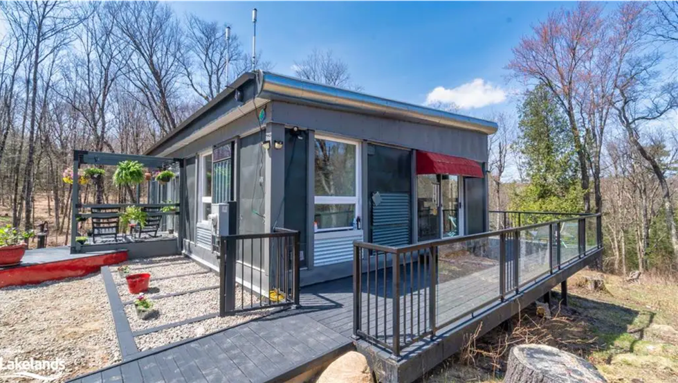 Exterior of the home with deck and sitting area.