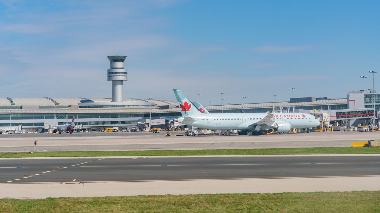 exterior of toronto pearson airport and planes on the tarmac