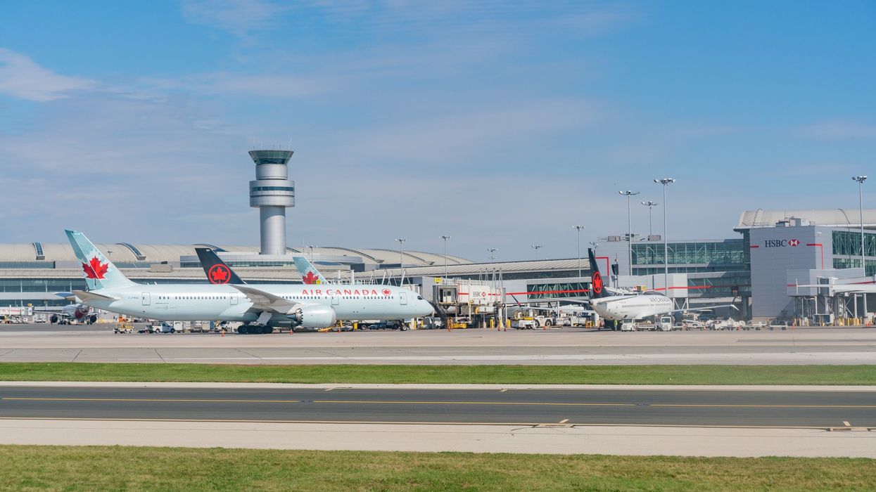 exterior of toronto pearson international airport with planes on the tarmac