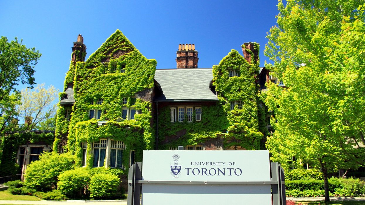 exterior of university of toronto building with a university of toronto sign