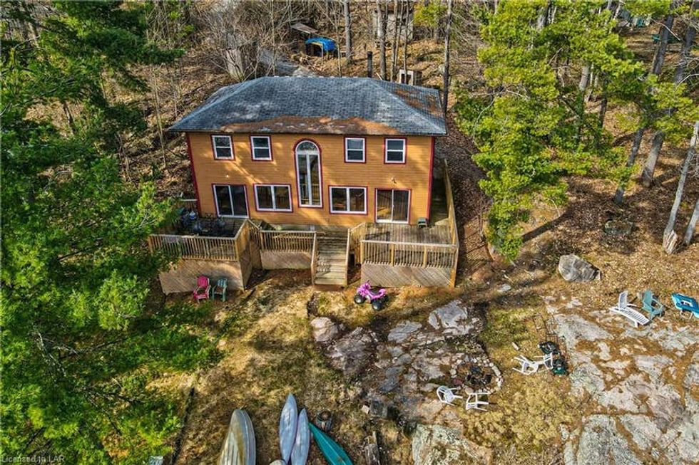 Ontario Cottage For Sale Under 700K Is Steps From A Shimmering Lake