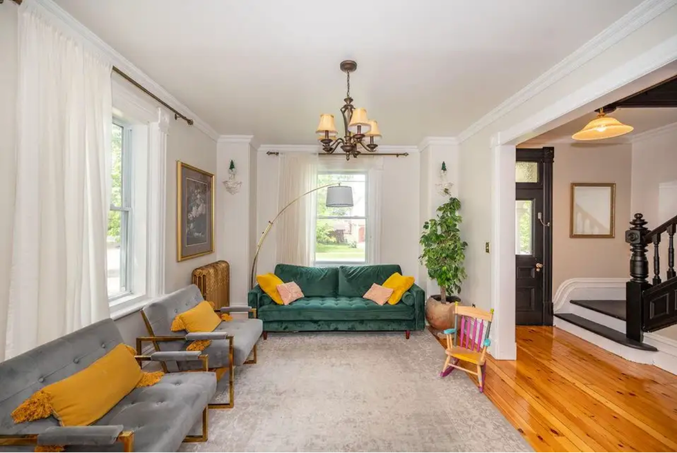 Family room with couches and chairs.