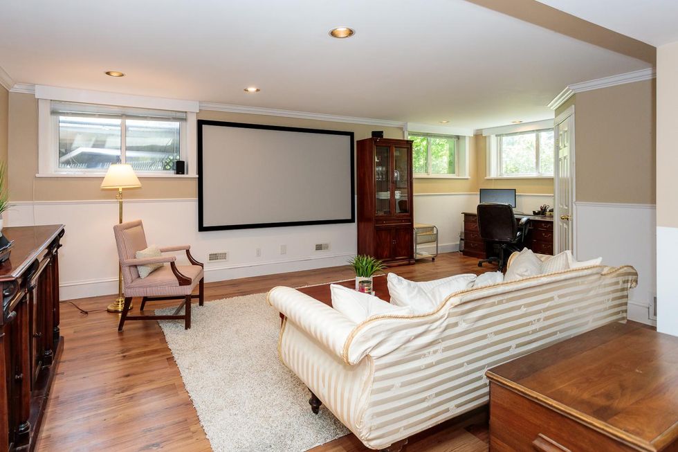 Finished basement media room in Ontario mansion.