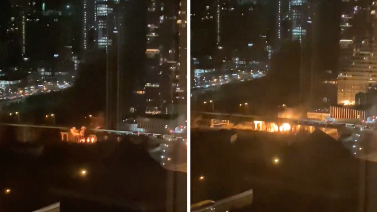 Fire under Bathurst Street bridge in Fort York.