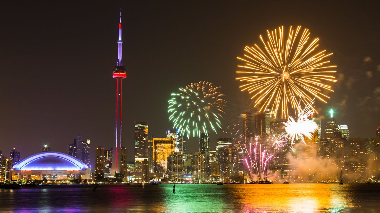 Fireworks in Toronto for Canada Day showing the City and local landmarks.