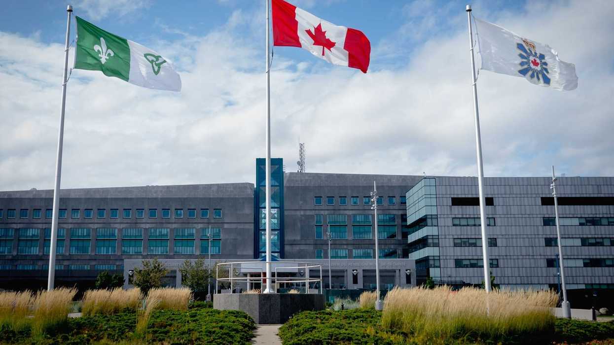 flags in front of csis headquarters building in ottawa