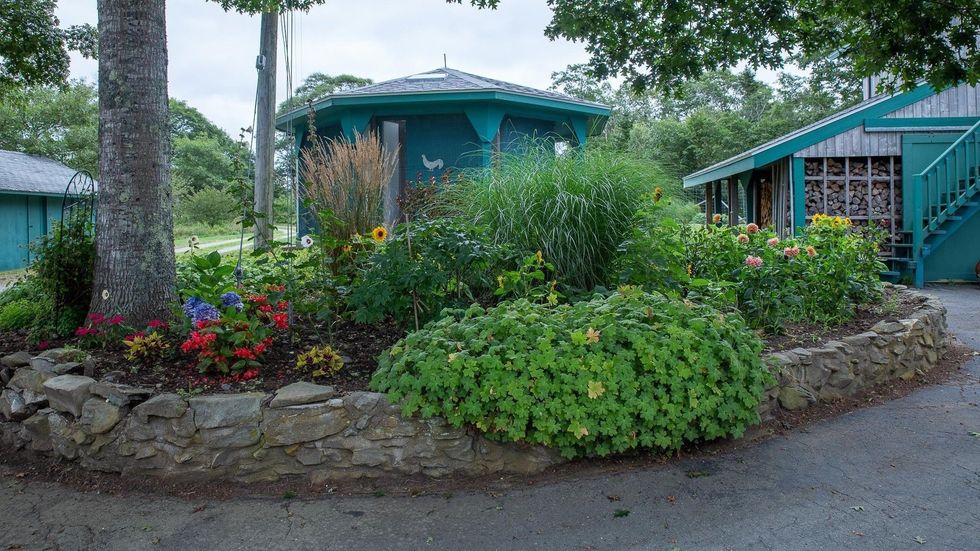 Flower garden on the property of the house for sale.