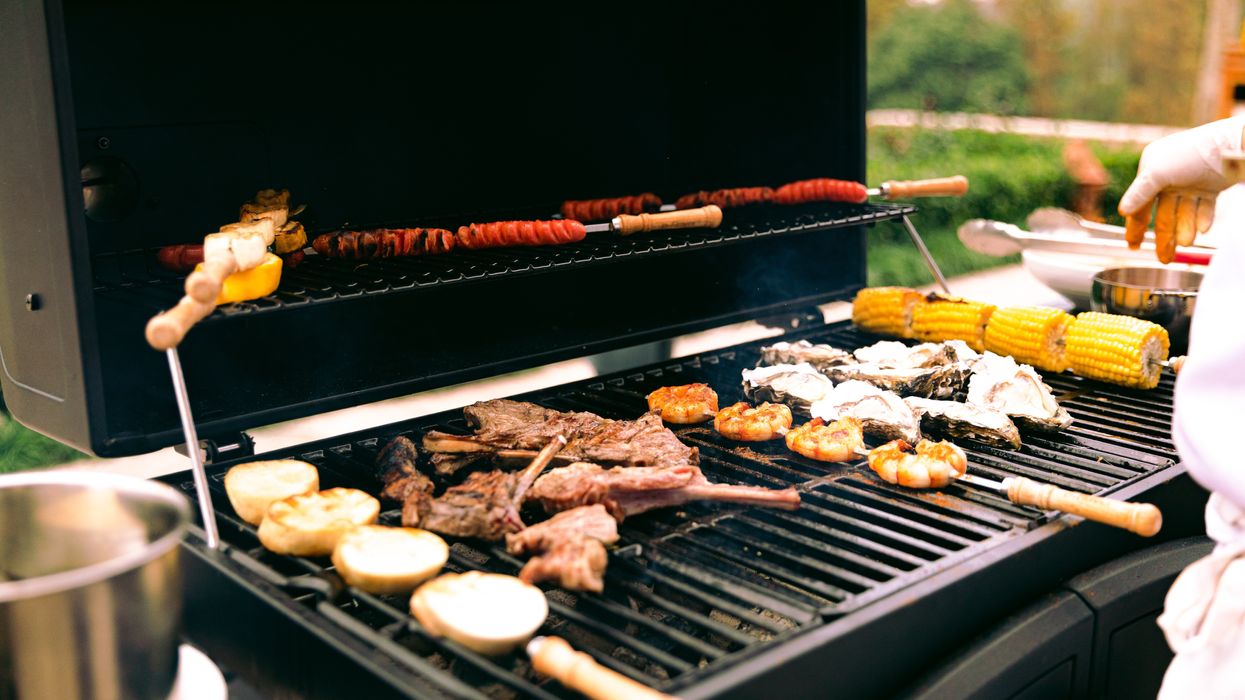 Food being barbecued on a grill.