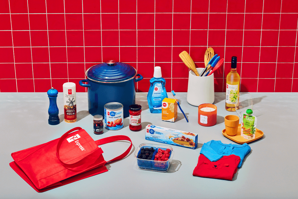 Food, pantry staples and toiletries delivered by PC Express laid out on a kitchen bench.
