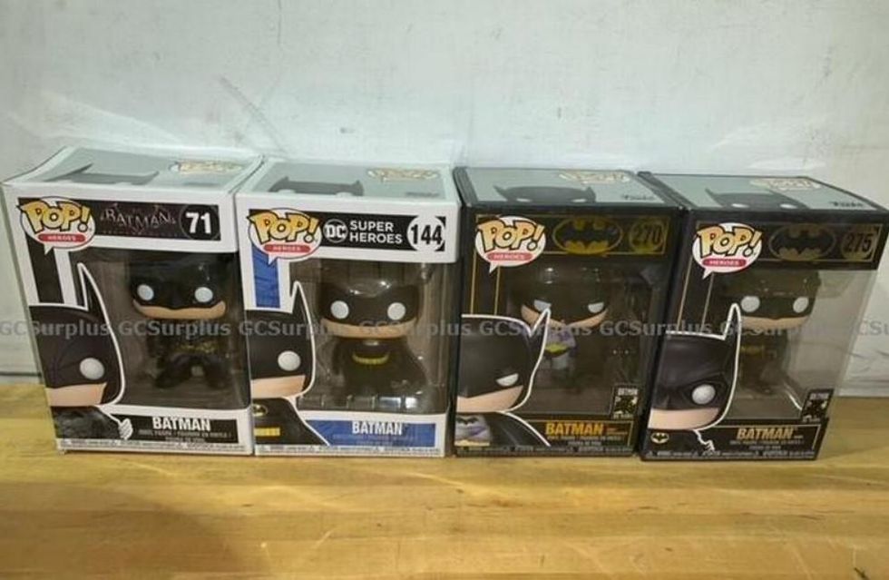 Four Batman Funko figurines.