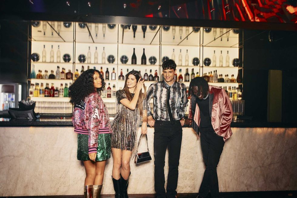 Four friends stand at Alu00e9a nightclub in Hu00f4tel-Casino du Lac-Leamy.