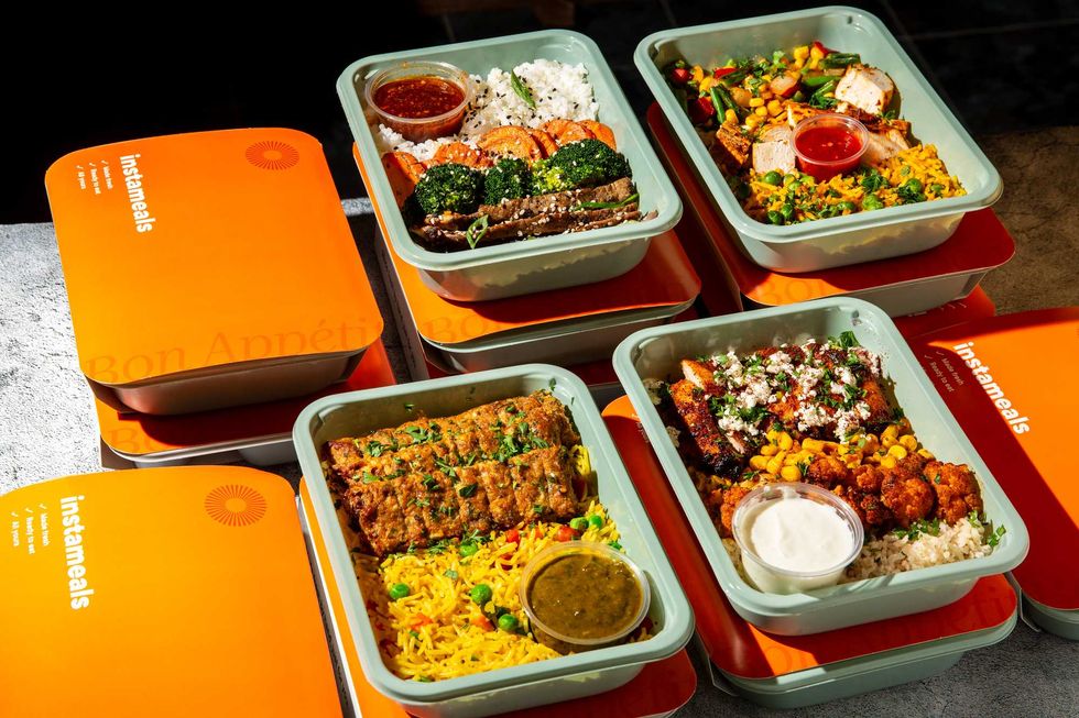 Four Instameals dishes arranged on a counter.