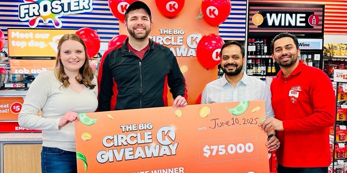 Four people holding a $75,000 Circle K Giveaway cheque inside a Circle K store in Ontario, surrounded by red balloons and contest signage.