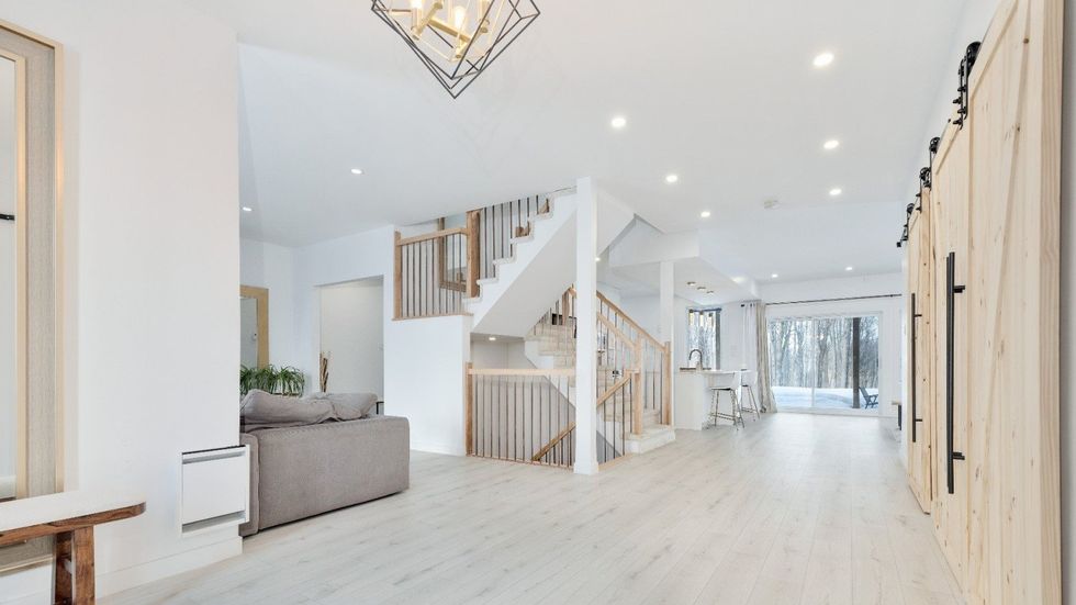 Foyer that opens up to the living room, kitchen and dining room.