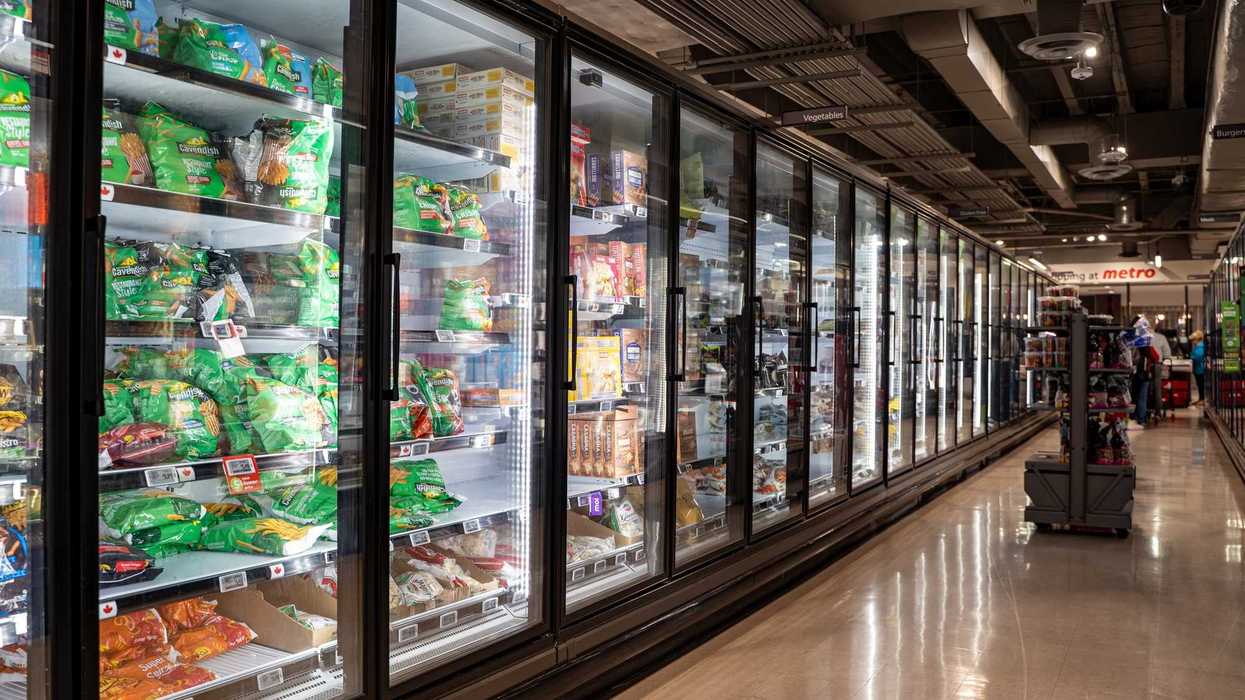freezers with food products in the freezer aisle of a grocery store in canada
