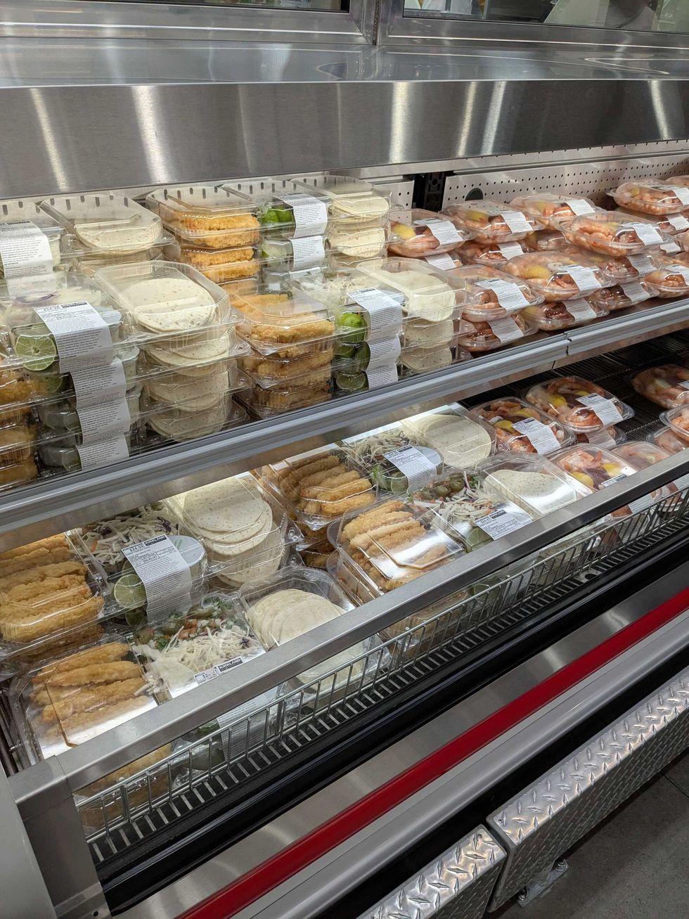 Fridge with shelves of premade meal section at Costco