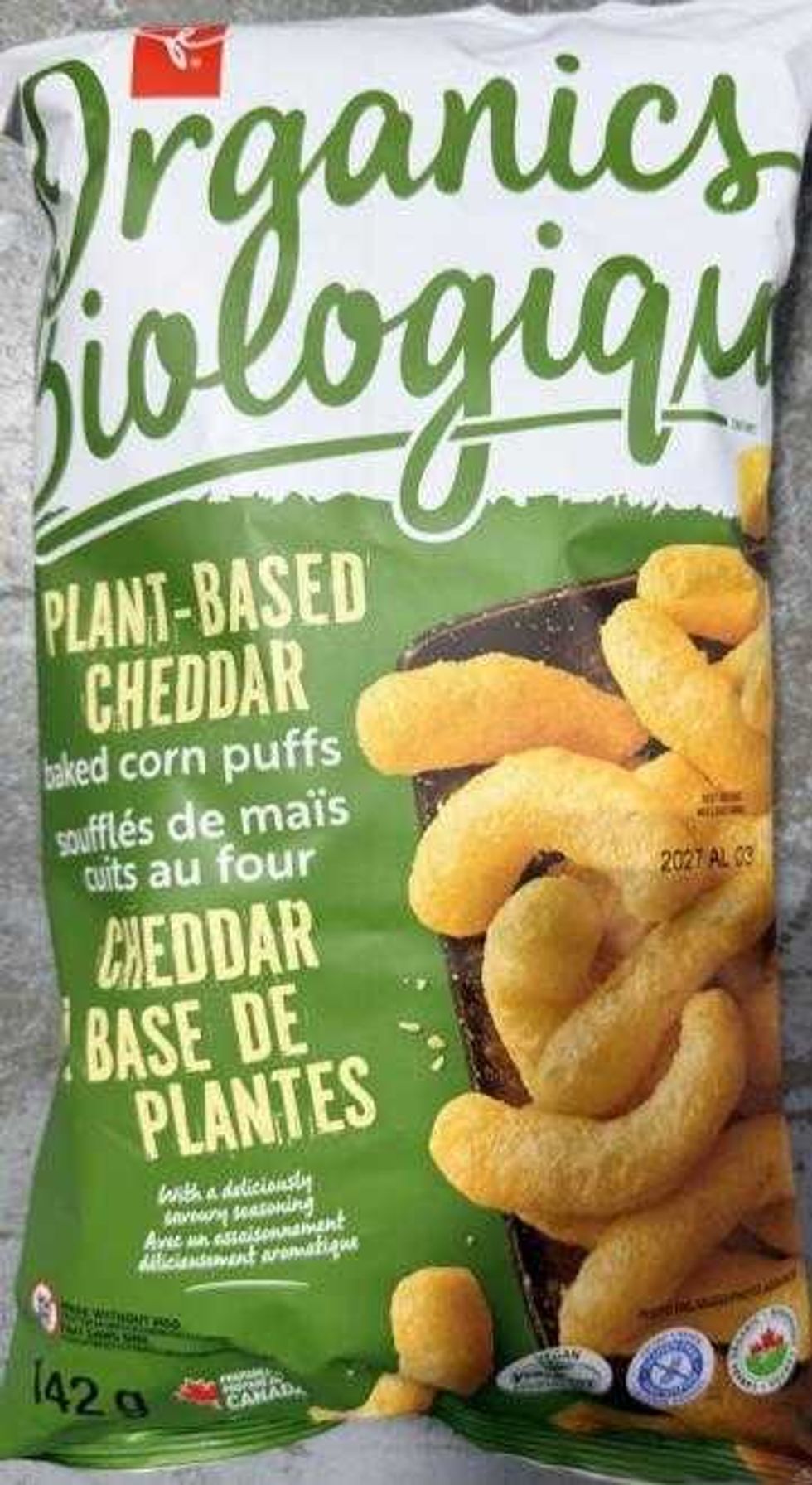 front of package of recalled PC Organics Plant-Based Cheddar baked corn puffs
