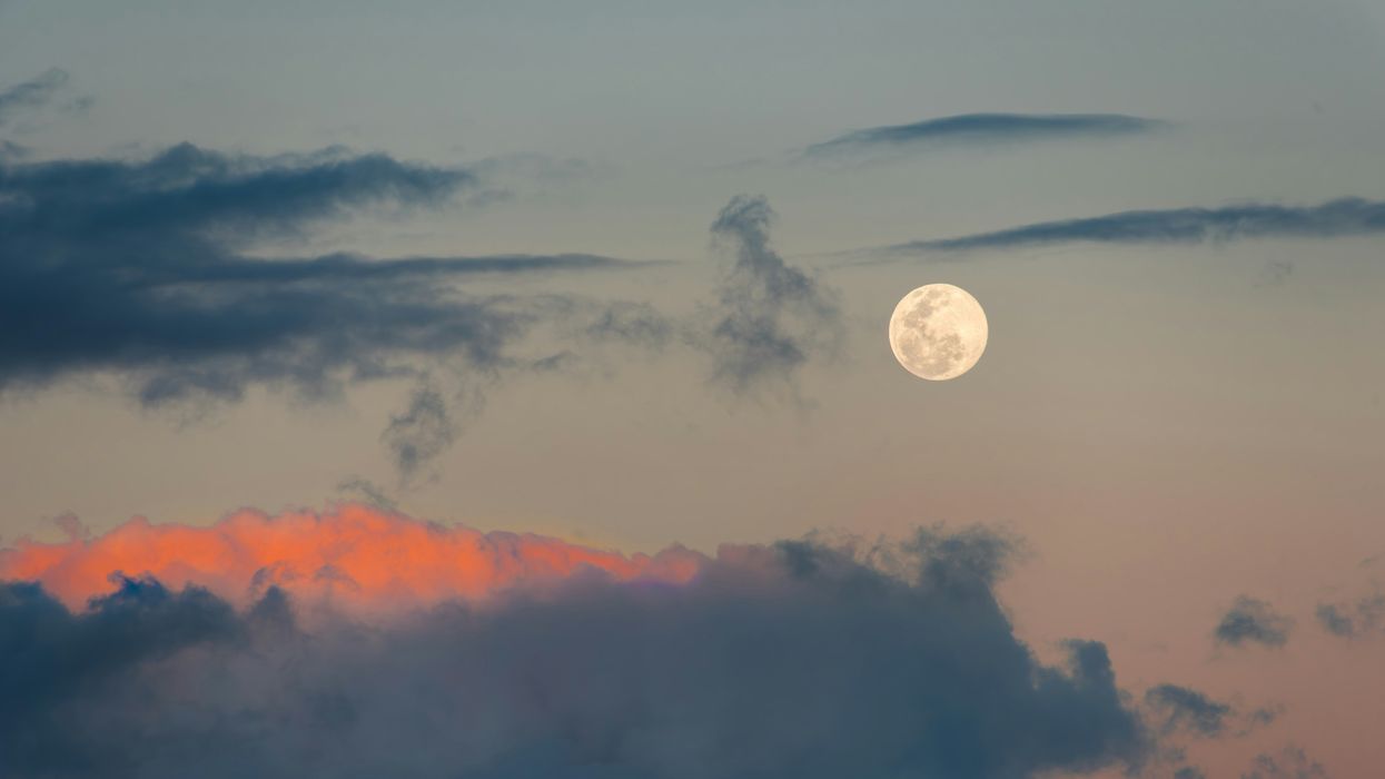 full moon in a cloudy sky